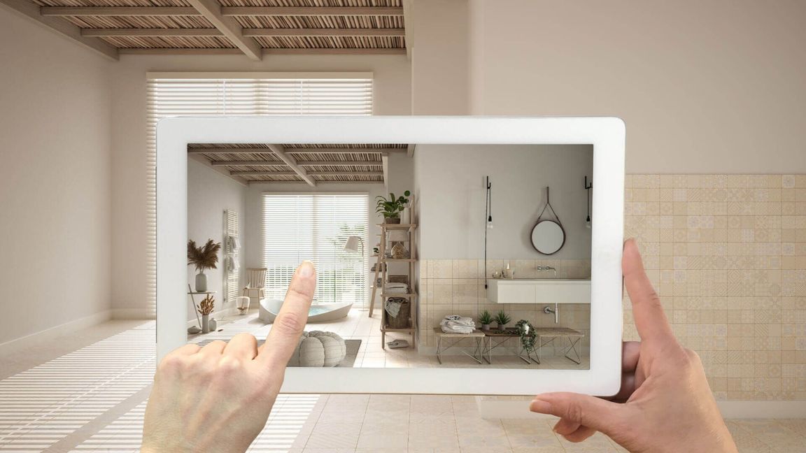 iPad showing augmented reality models of furniture in the room