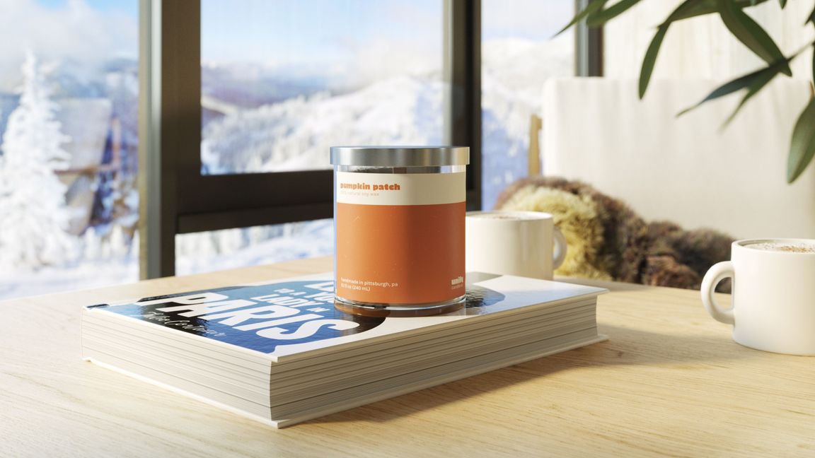 3D rendering of a soy candle on a book in a cozy winter interior