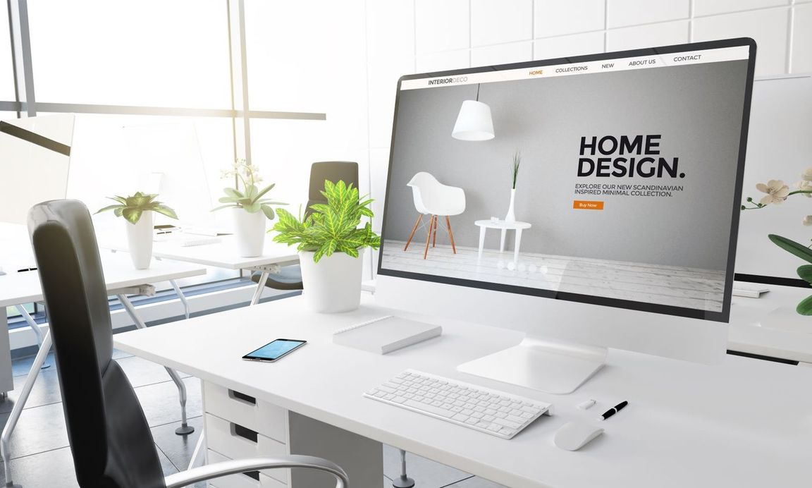 Computer with a furniture website shown on the screen