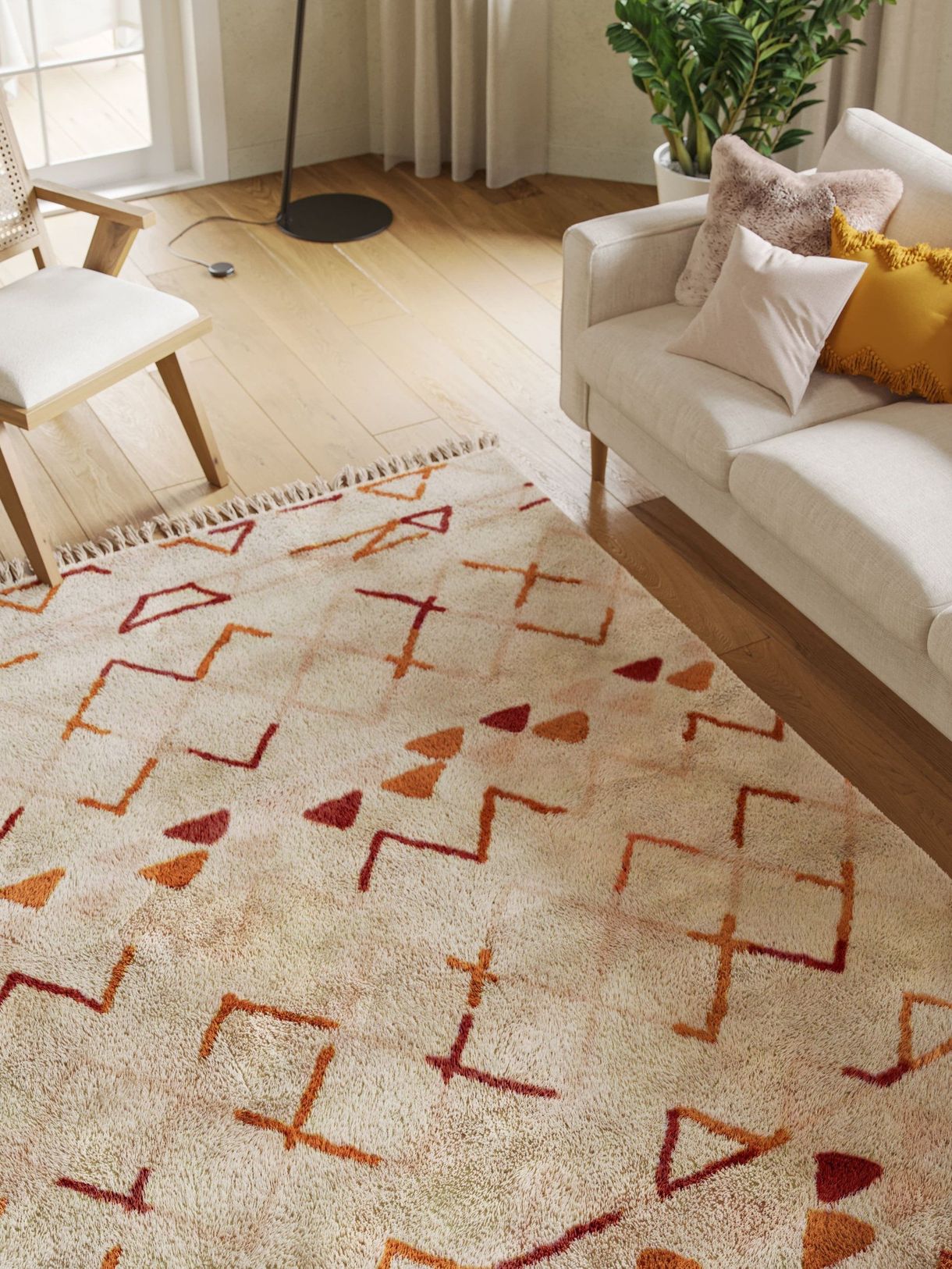 3D rendered house fittings in a trendy living room showcasing a sofa, chair, and decorative rug, highlighting 3D house fittings modeling and rendering.