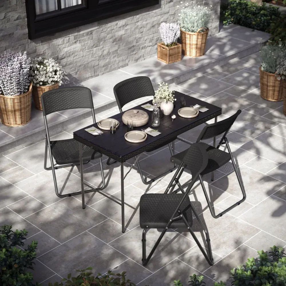 3D visualization services showing outdoor dining table with black folding chairs set for a meal