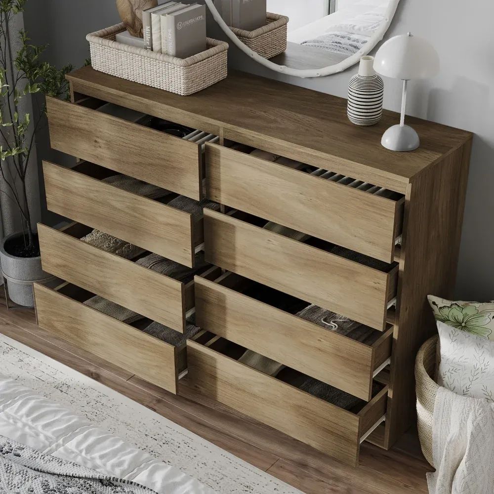 3D visualization of a wooden dresser with multiple drawers open, revealing neatly folded clothes inside