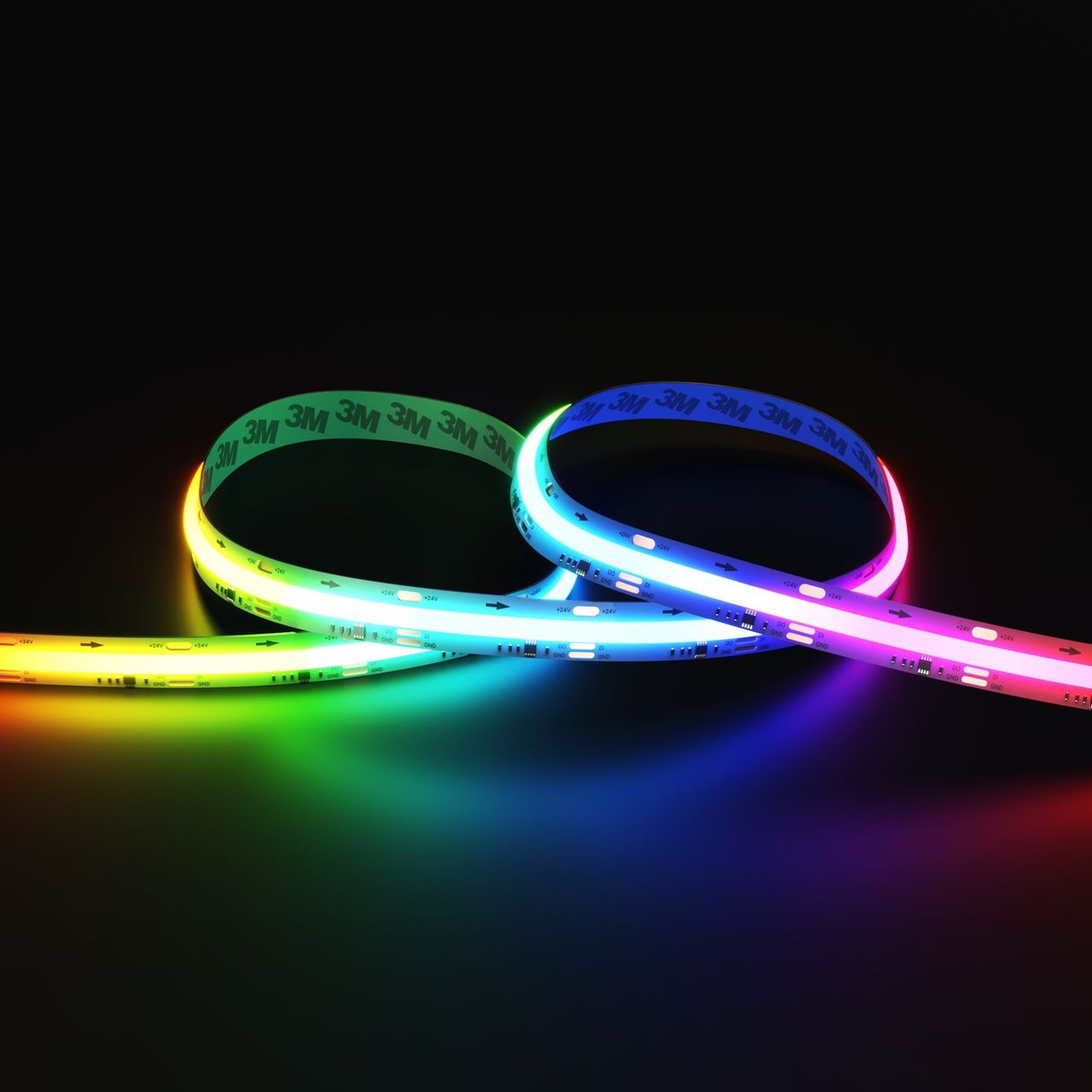 Flexible RGB LED light strips arranged in loops with multicolor illumination on a dark background in product rendering