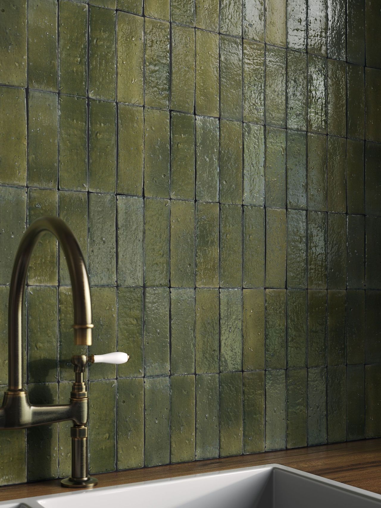 Close-up 3D visualization for tiles showing handcrafted zellige surface behind a brass faucet