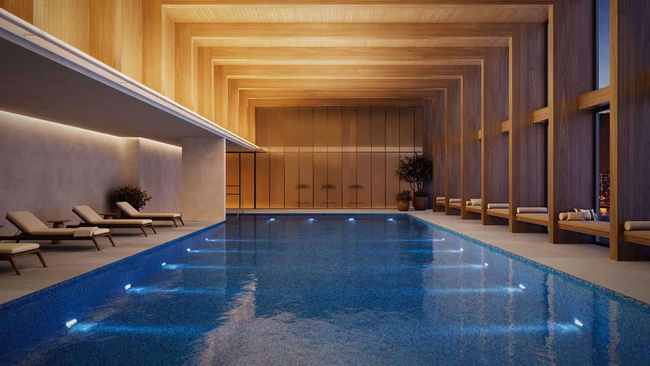 An indoor pool with warm cove lighting shown in an architectural lighting render
