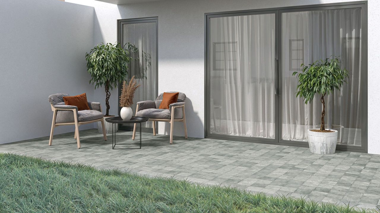 3D Rendering of a serene ground-level patio with gray stone-effect tiles, potted plants, and neutral outdoor furniture