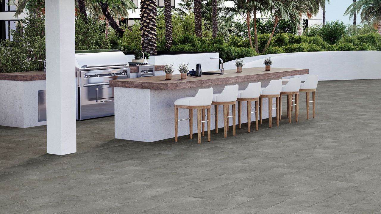 Product rendering of a stylish outdoor area with dark grey tile flooring and wooden countertops