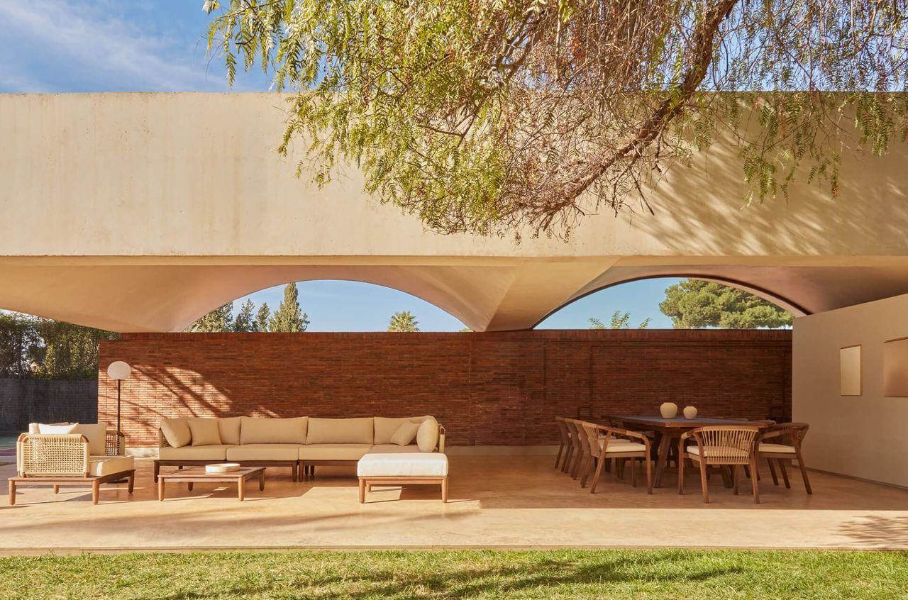 Sunlit patio furniture CG rendering for dining and seating group