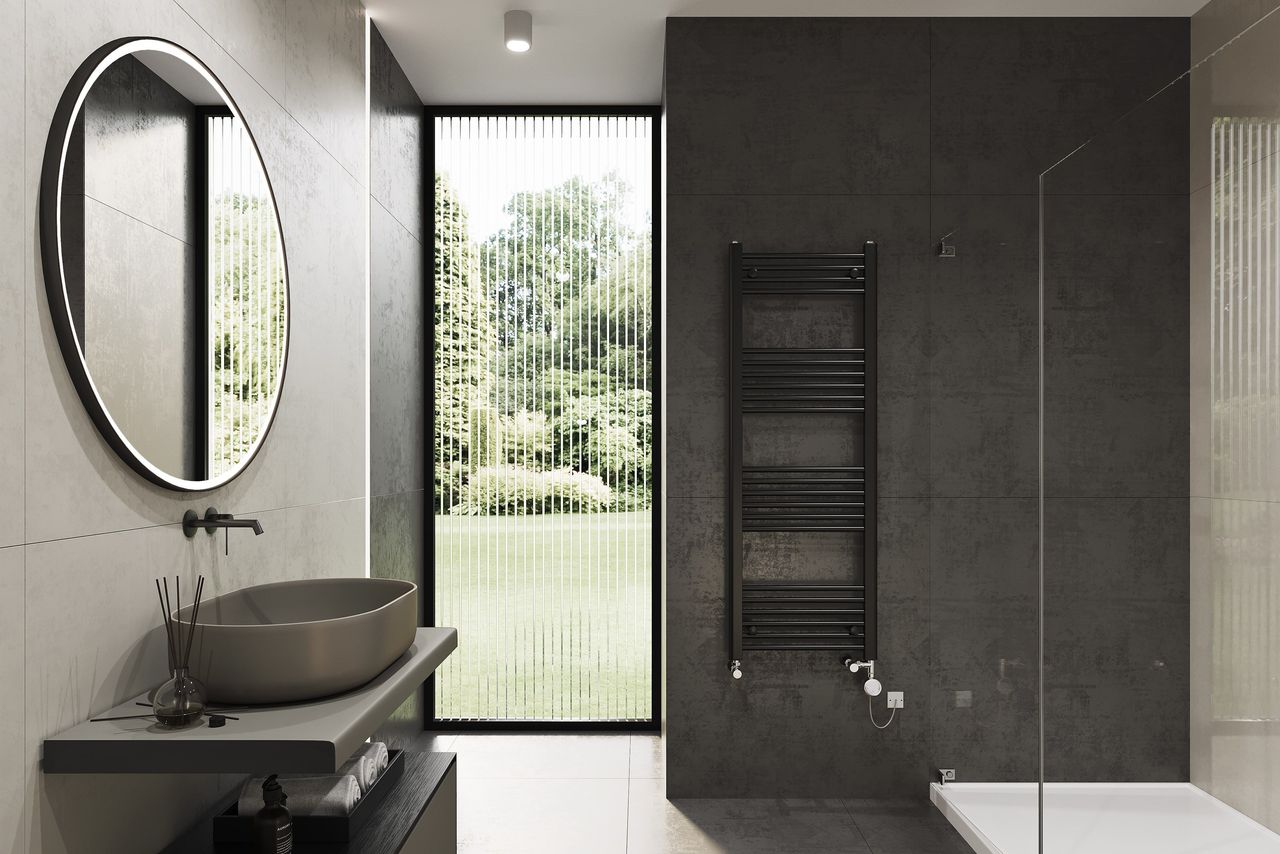 Wall-mounted Ladder Radiator in a Black Bathroom