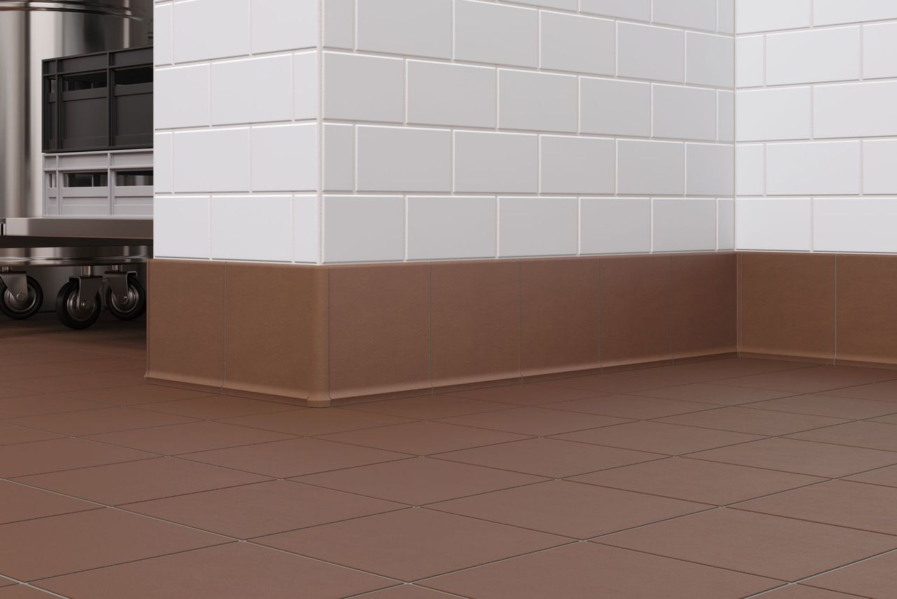Rendering showing close-up tile detail in a commercial kitchen setting with metallic fixtures