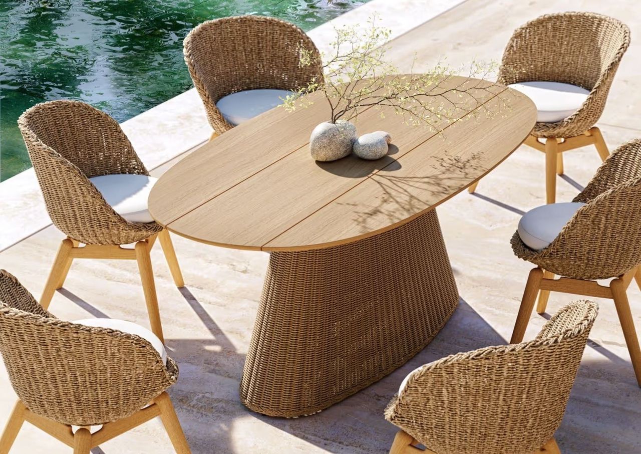 Product 3D render of an outdoor dining table surrounded by woven chairs in natural sunlight