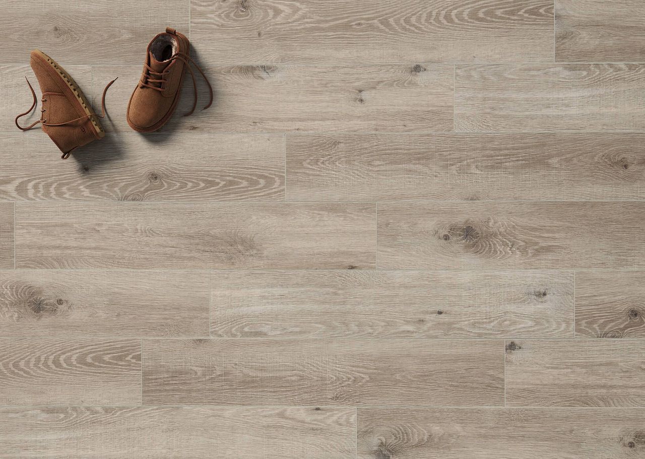 3D visualization of beige wooden flooring with visible shoe pair placed on surface in top view
