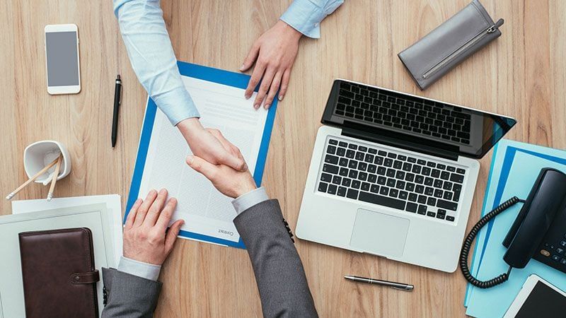 A Client and a Manager Shaking Hands Before Starting an AR 3D Modeling Project