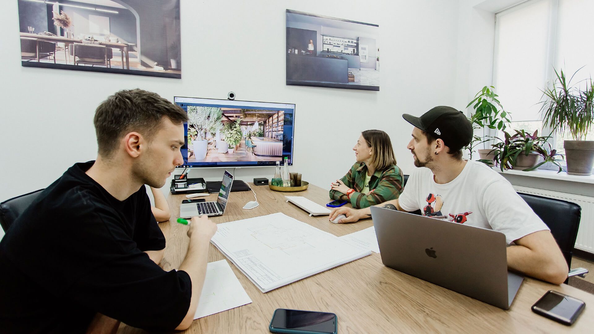 A CGI Team Discussing 3D Rendering Project Issues in a Meeting Room