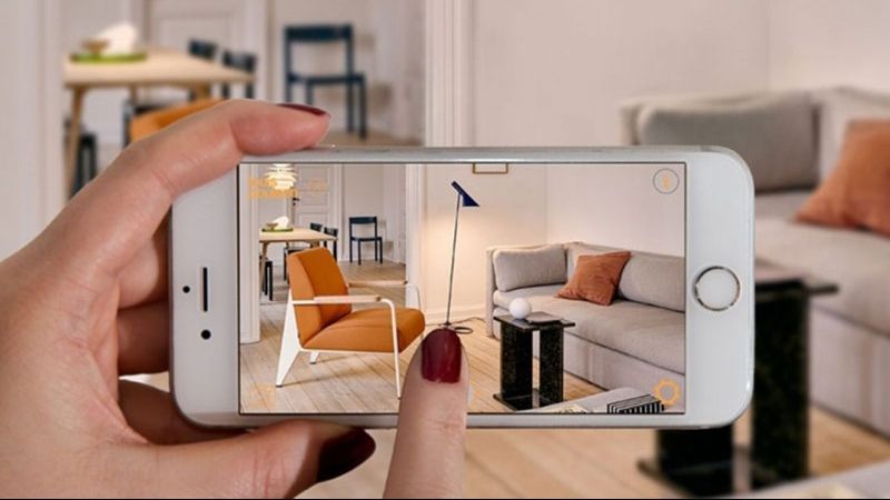 A Person Using AR App Made to Sell Furniture Pieces Online