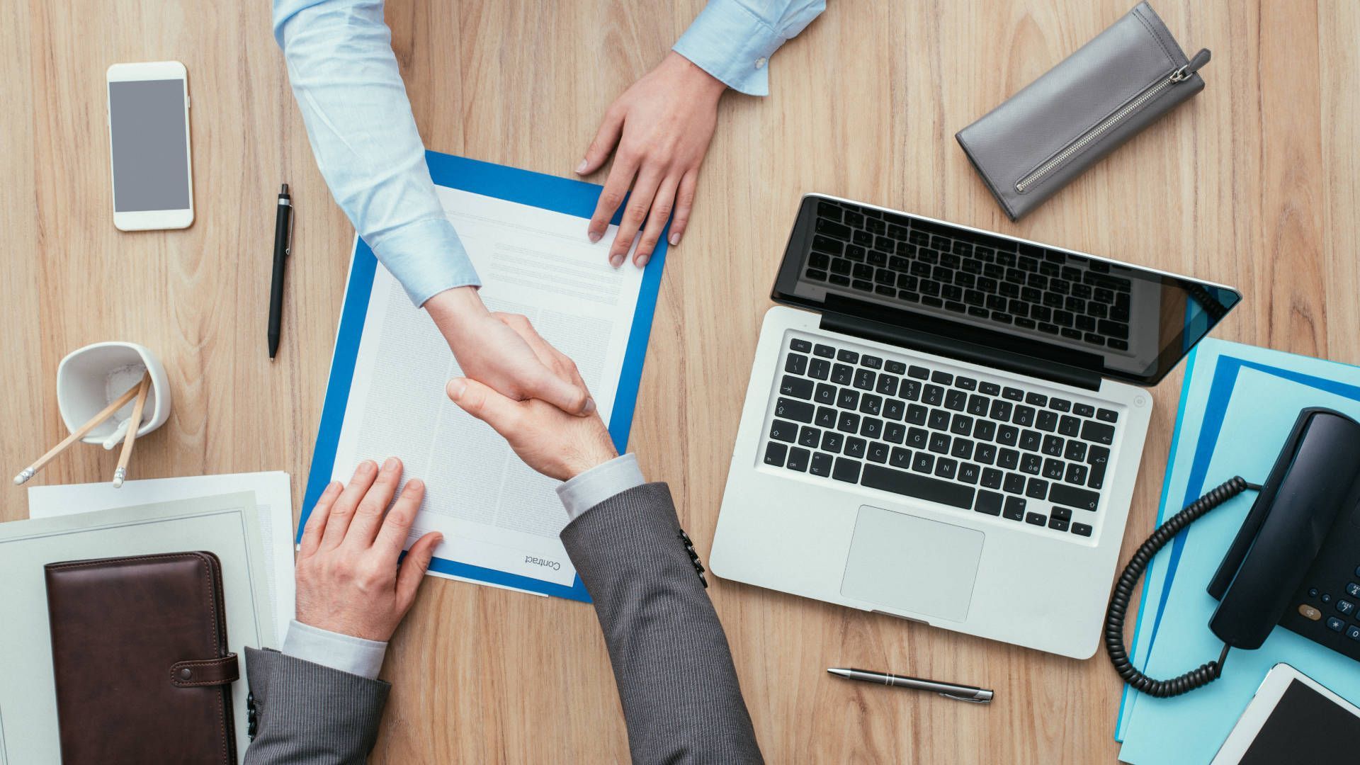 A Client and Manager of a CG Company Shaking Hands Starting a Product Animation Project