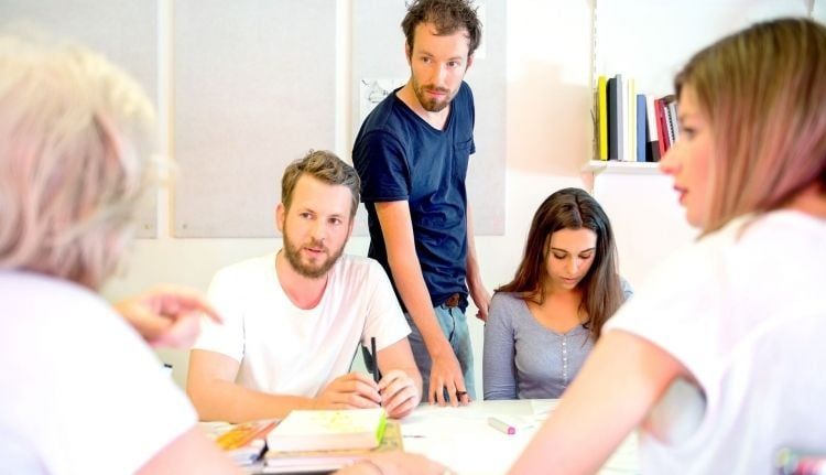 People working on adjusting the design prototype