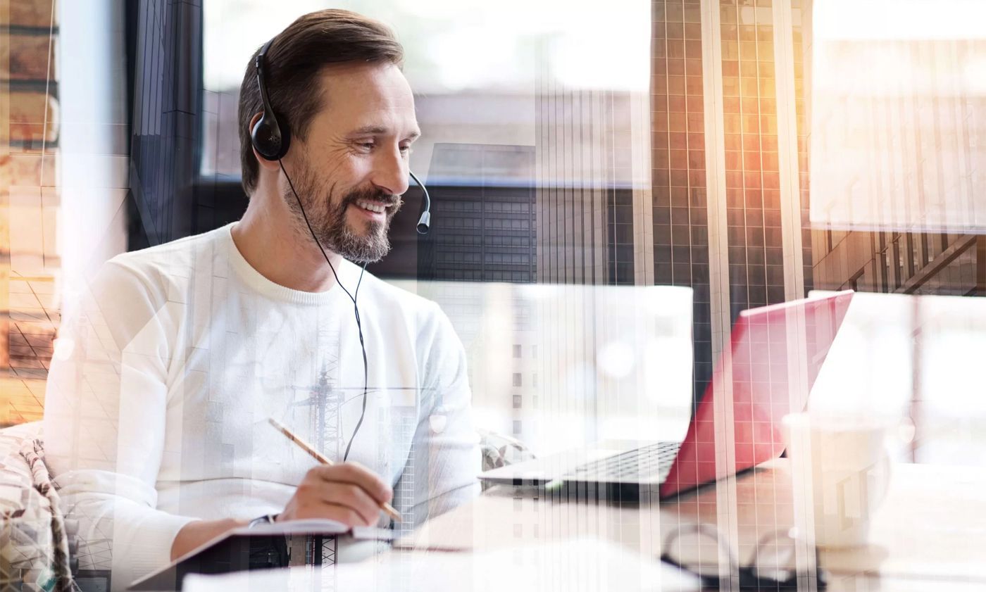 Man taking notes at a web conference
