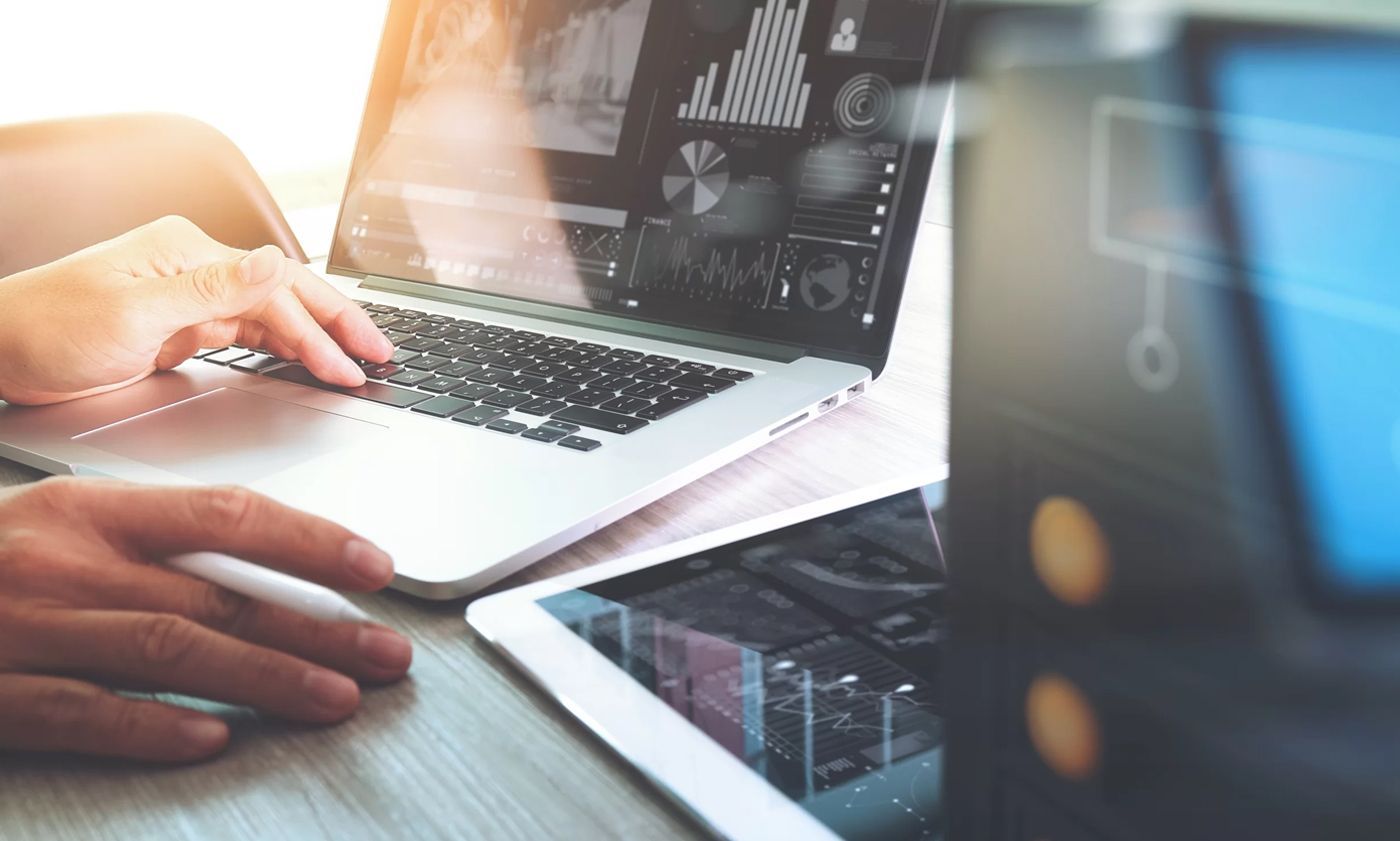 Laptop with E-commerce Stats on the Screen