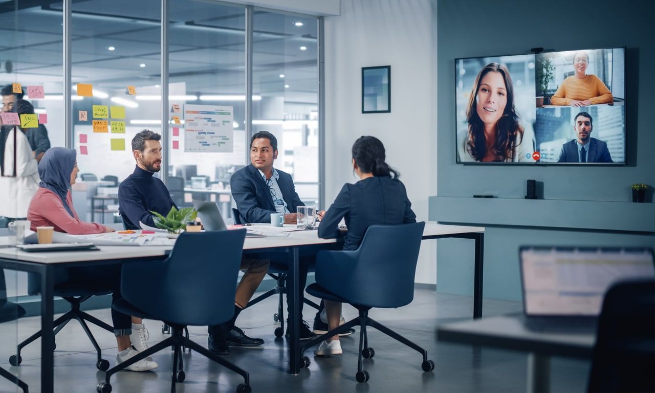 Team members in a work meeting collaborating using the DMAIC framework.