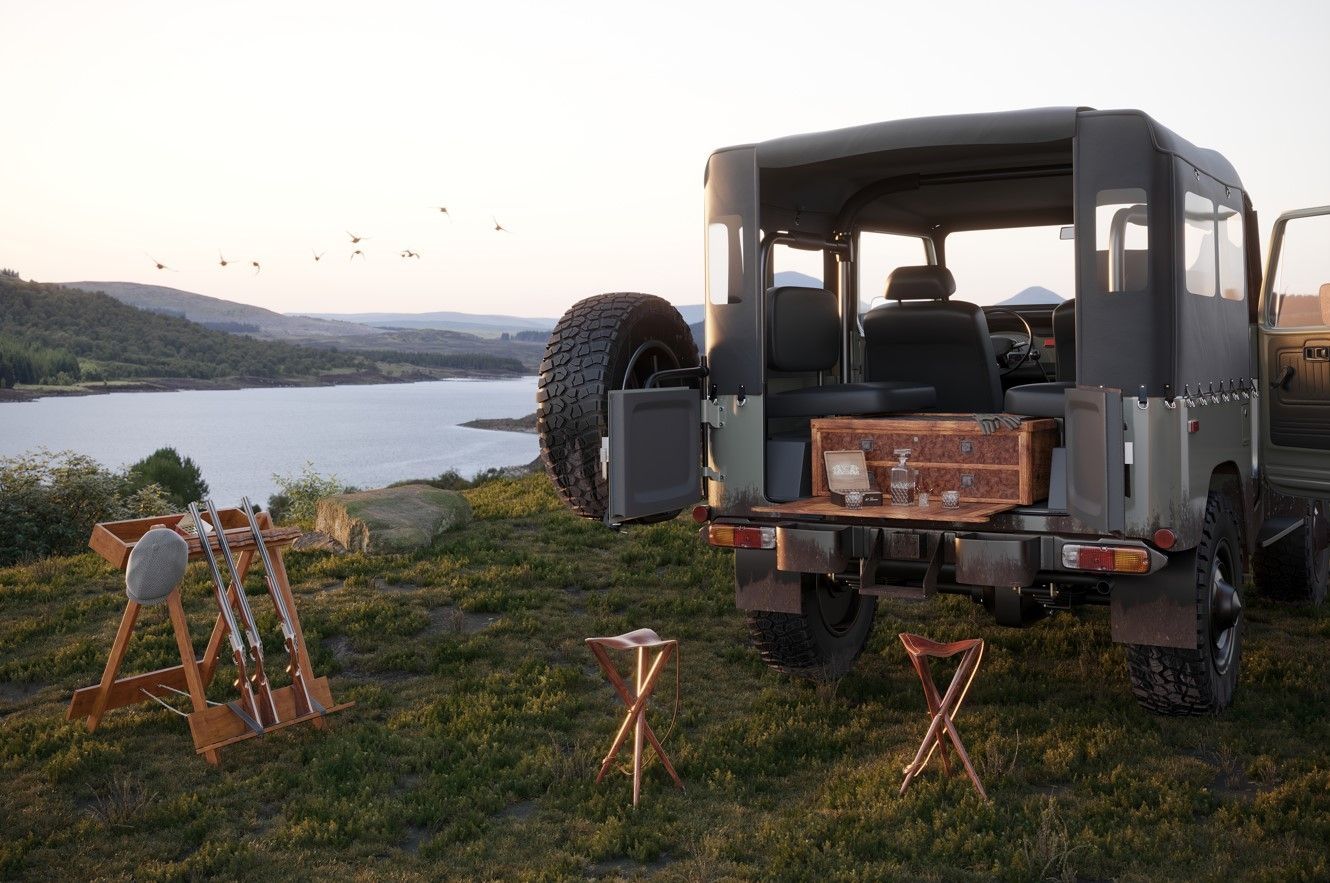 3D-rendered product visualization of a picnic set placed outdoors next to a parked off-road vehicle.