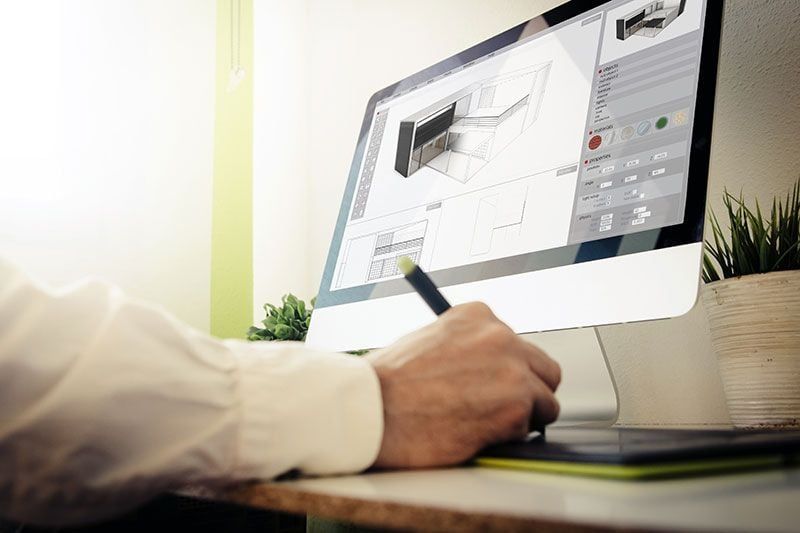 A Man Creating Designs of a 3D Model Based on Photos