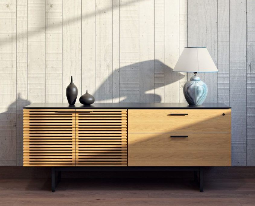 3D visualized product image of a living room media console with table lamp on it.