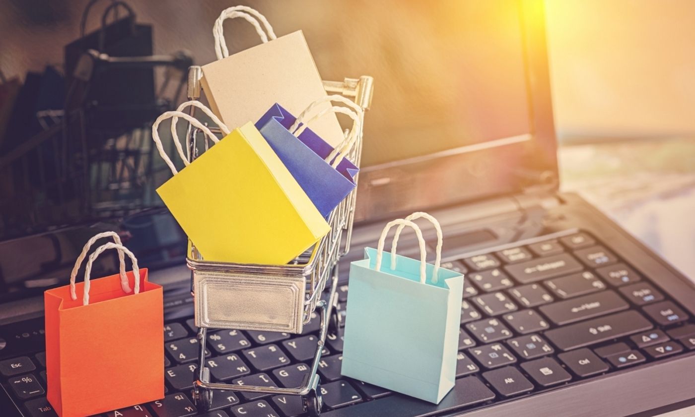 Shopping bags on a laptop showing the e-commerce sales