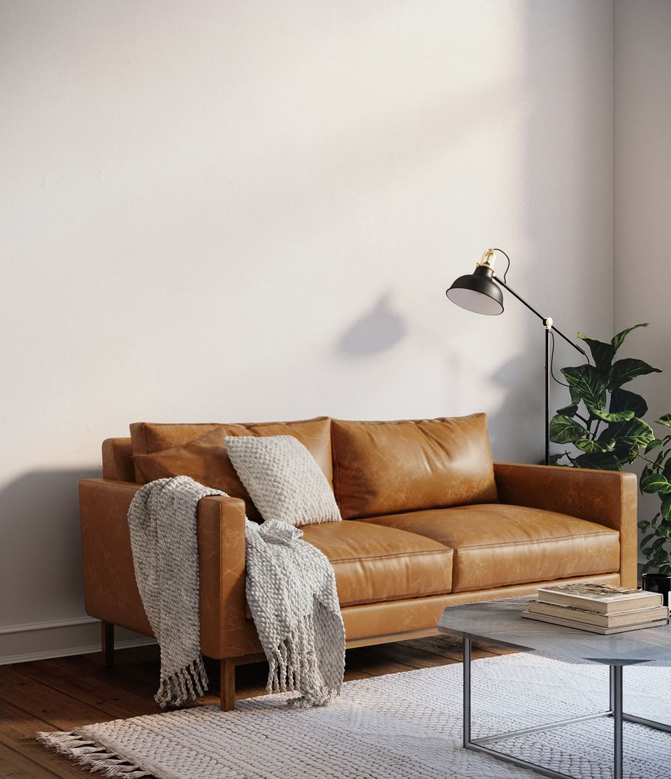 Photorealistic 3D rendering of a leather sofa in a trendy interior setting, showcasing high-end house fittings visualization and 3D modeling.