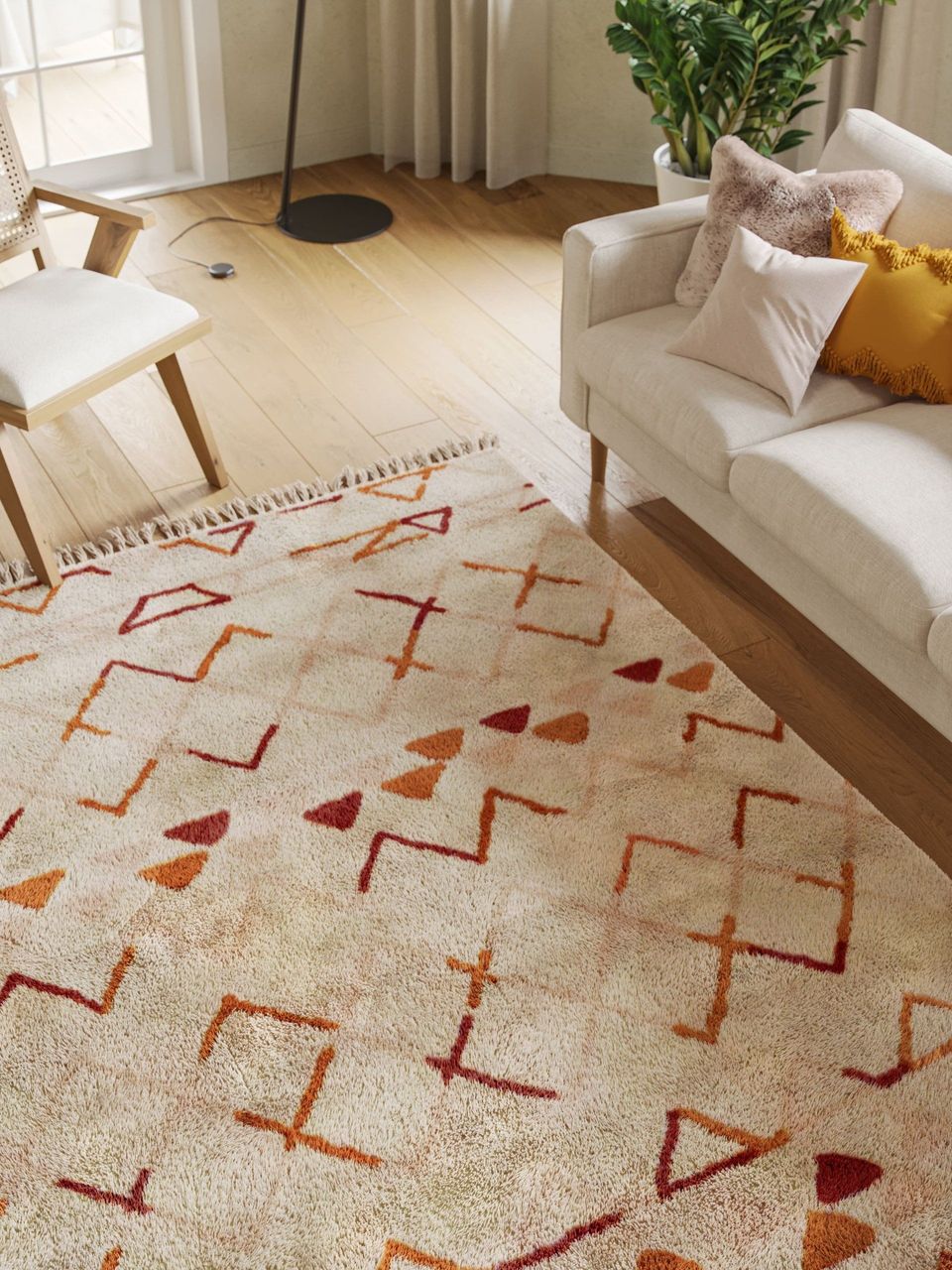 3D rendered house fittings in a trendy living room showcasing a sofa, chair, and decorative rug, highlighting 3D house fittings modeling and rendering.