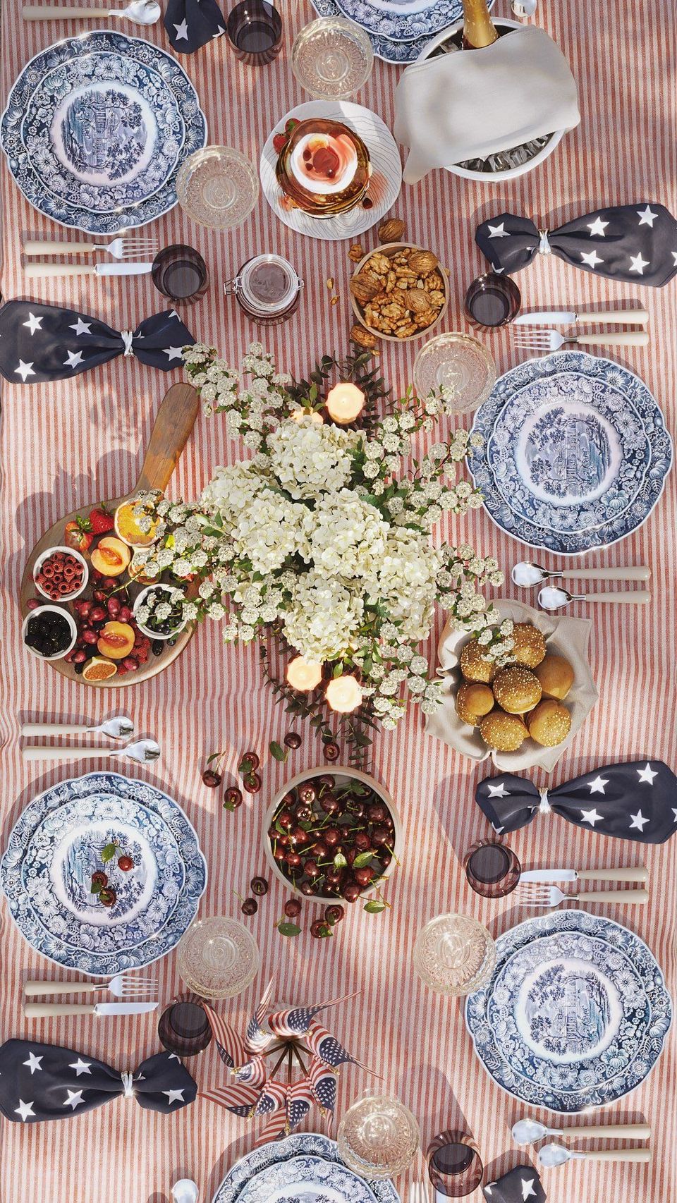 High-quality 3D rendering of a festive table with plates, flowers, and food, showcasing 3D furniture modeling and visualization.