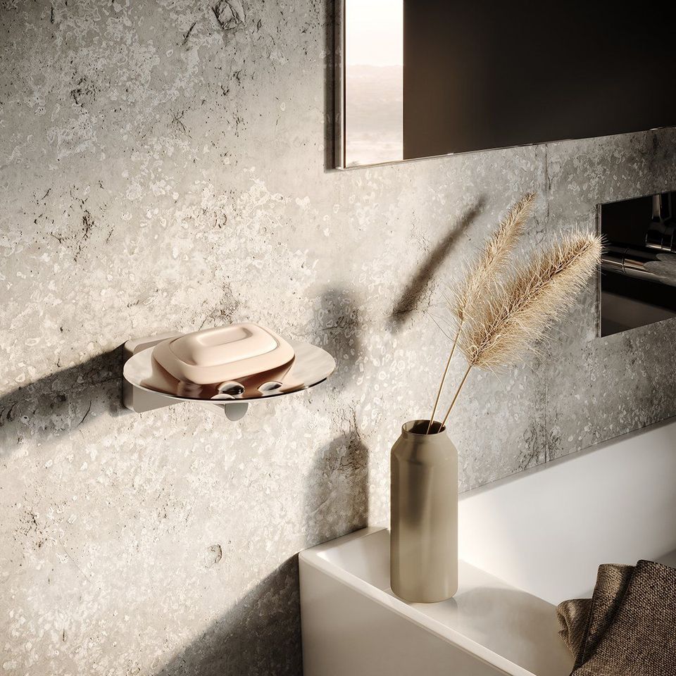 3D Rendering Of A Modern Bathroom Wall With A Metal Soap Dish, Beige Stone Texture, And Decorative Vase