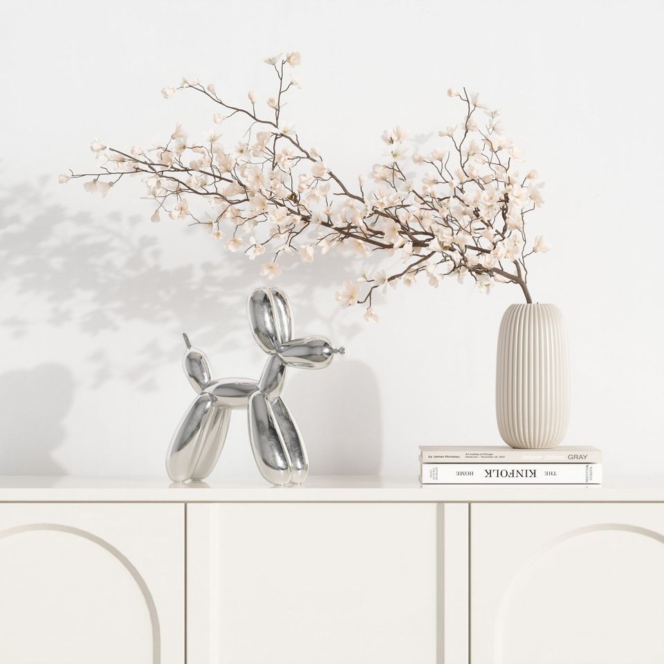 Lifestyle Rendering Of White Console Table With Silver Balloon Dog Sculpture And Decorative Vase