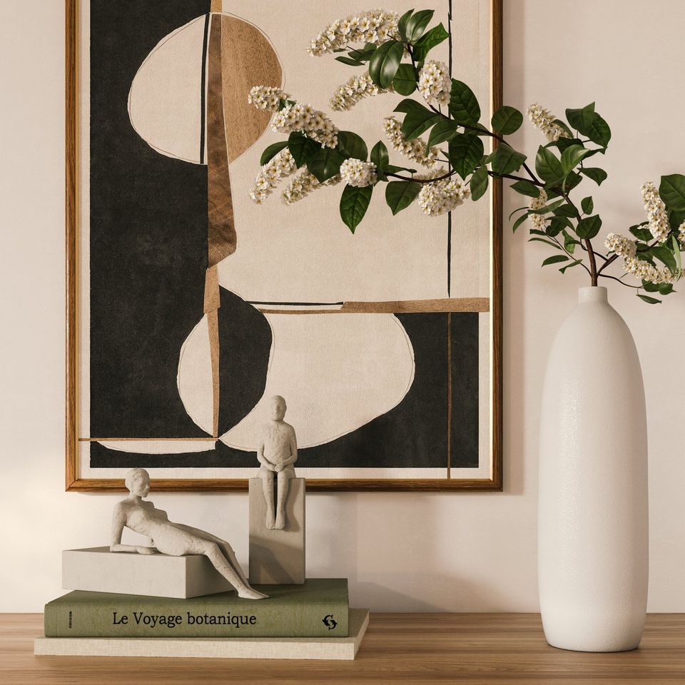 3D rendered image showcasing interior visualization with artistic decor, featuring a vase, books, and sculptures on a wooden surface.