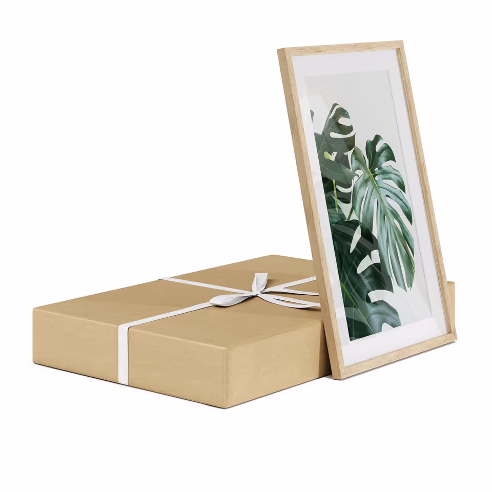 Photoreal 3D rendering of a framed artwork with a leaf design and a gift box, showcasing photorealistic product visualization and CGI rendering.