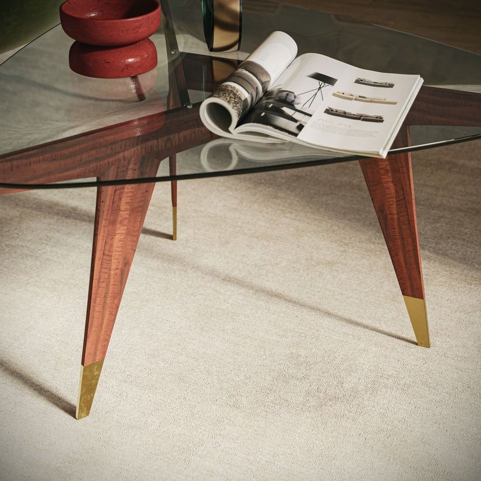 Realistic 3D rendering of a trendy glass coffee table with wooden legs, showcasing realistic house fittings visualization and photorealistic CGI.