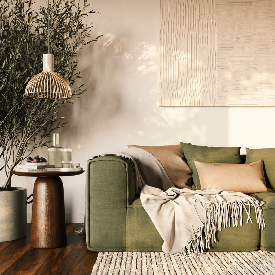Lifestyle Rendering Of A Green Sofa With Beige Accents And Indoor Plant On Wooden Floor