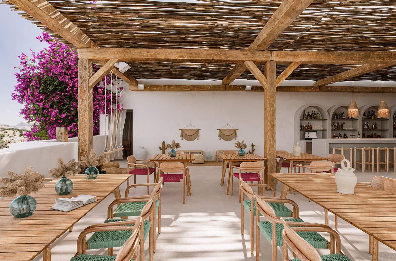 Product visualization of an outdoor restaurant seating set in a rustic terrace lifestyle scene