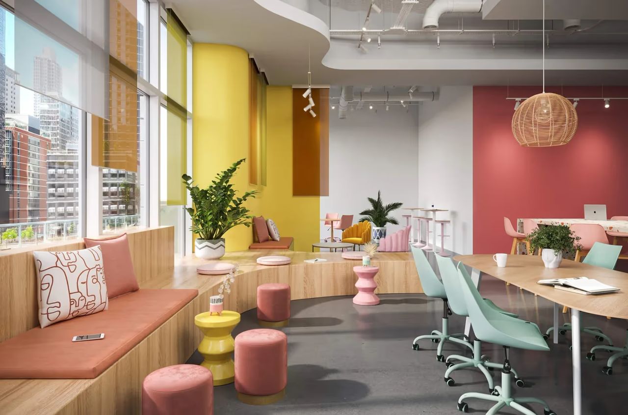 Product visualization showing a modern office lounge furniture set in a pastel coworking space