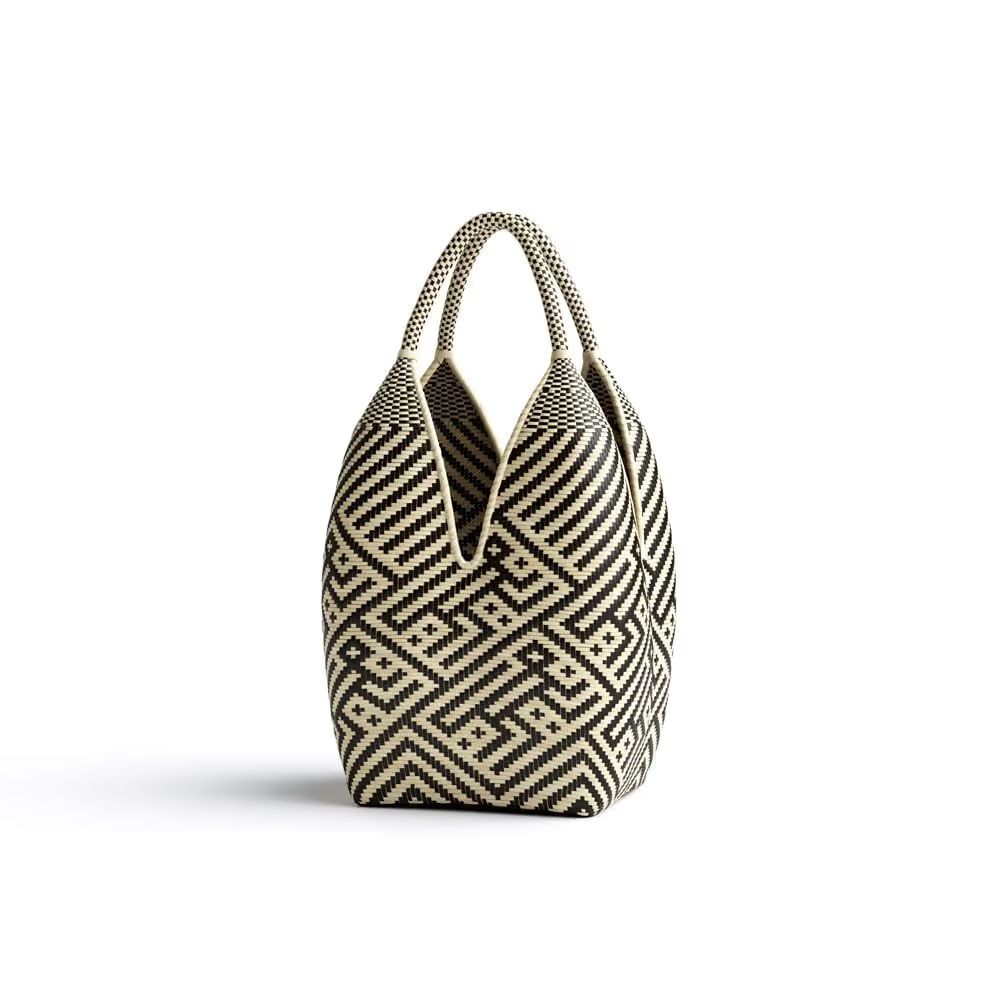 Silo render of a woven handbag highlighting textile texture, pattern detail, and overall shape