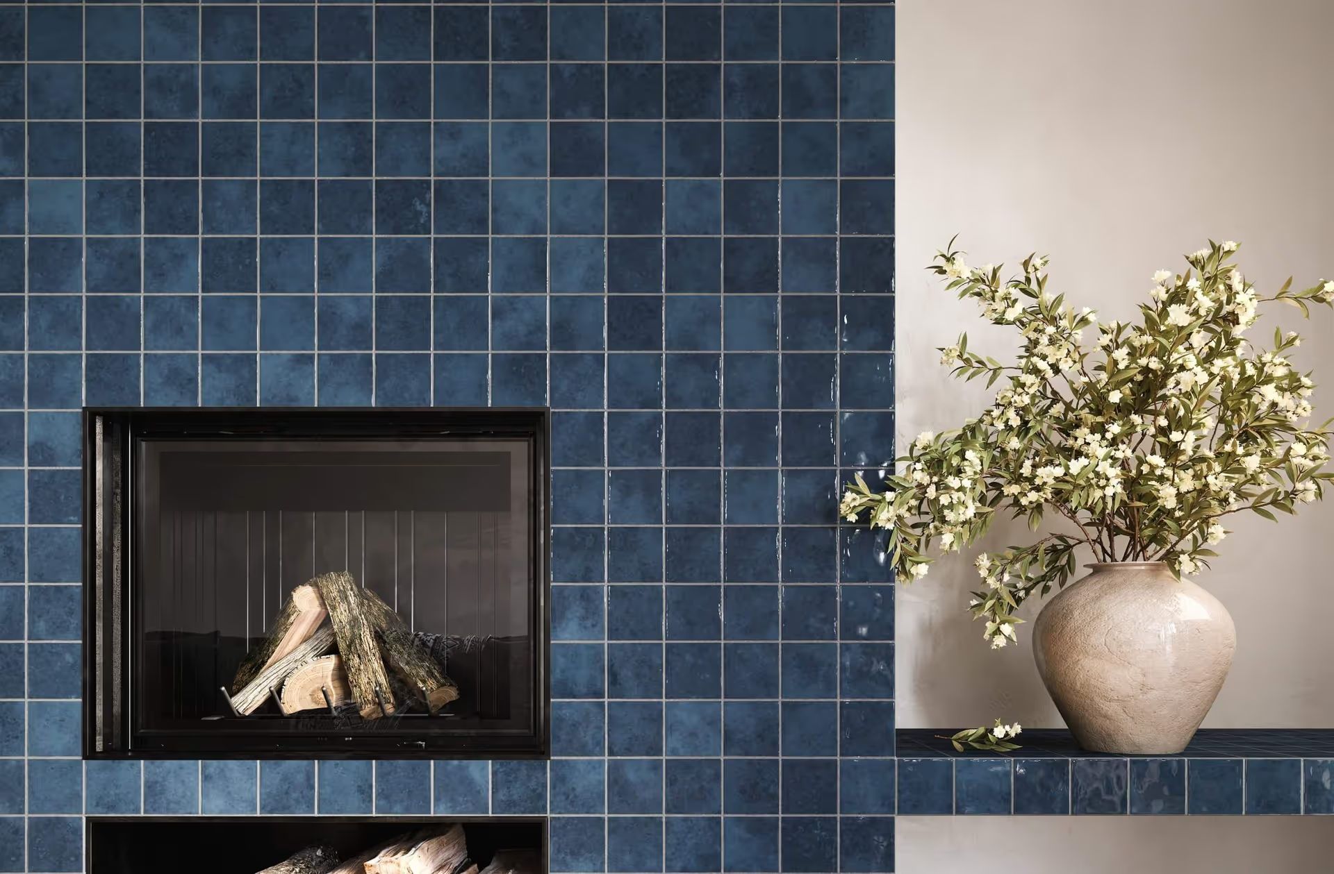 CGI Photography shows a modern hearth surrounded by muted navy blue tiles, with minimalist styling