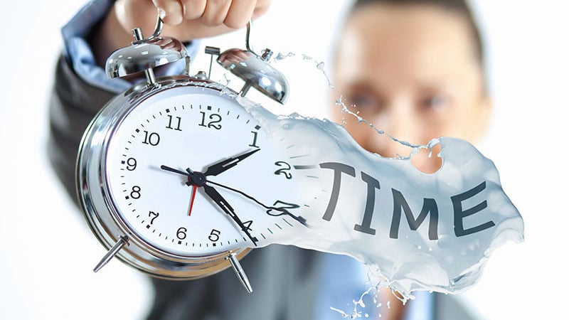 A 3D Rendering Specialist Holding a Clock in Her Hands