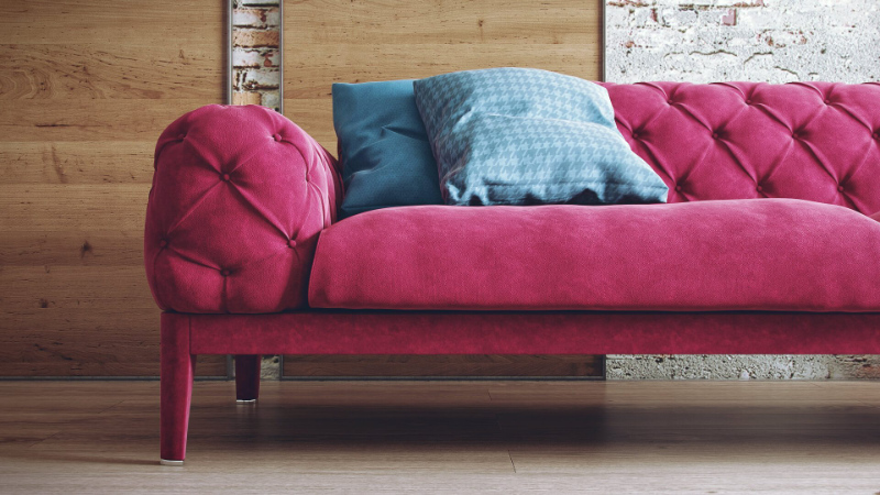 A Close-Up Type of an Image Showing a Pink Suede Quilted Sofa