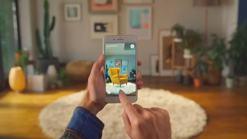 A Customer Using Augmented Reality App Developed by IKEA Brand