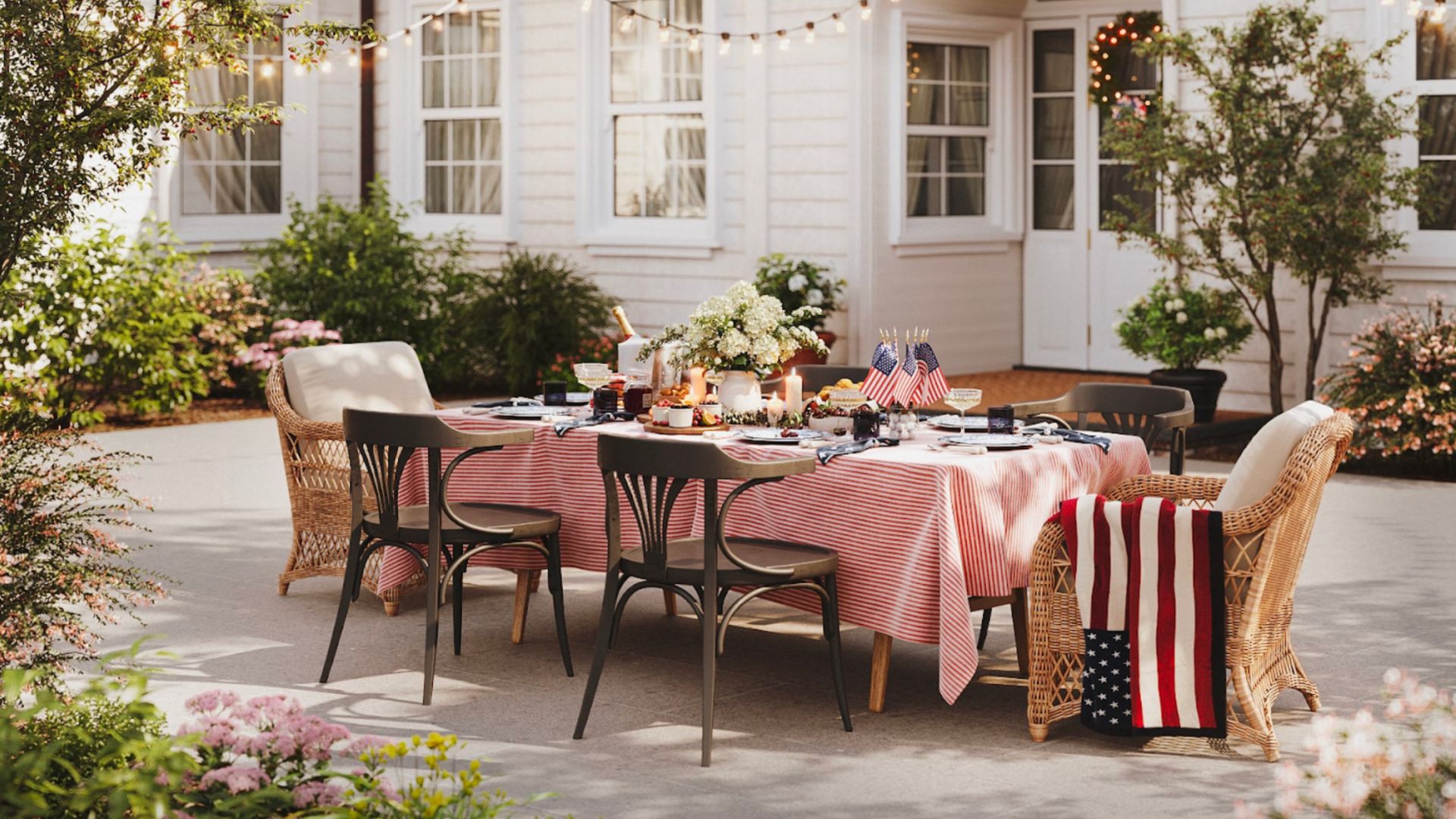 An inviting outdoor dining area prepared for a Fourth of July celebration, combining product placement with seasonal festivities for a targeted marketing approach.