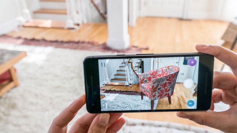 AR for ecommerce social media filter — user trying virtual furniture in real room