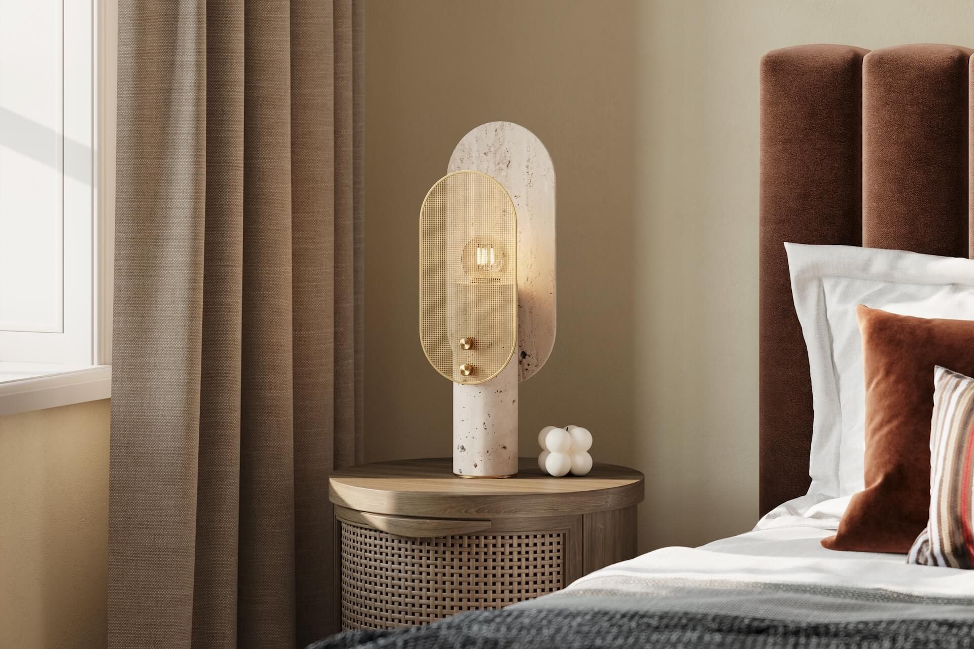 Close-up of a velvet headboard, bedding and a bedside lamp