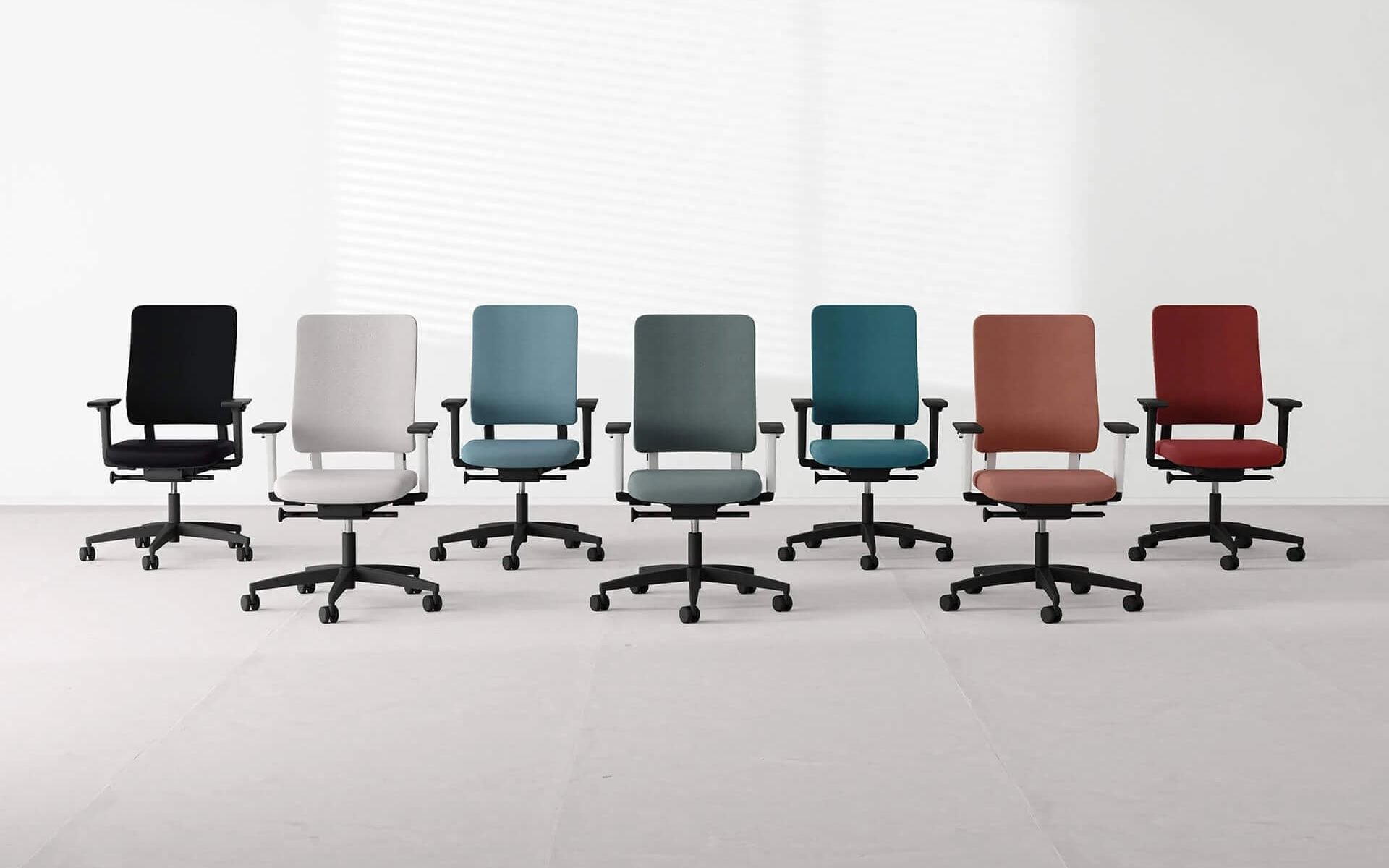 3D render of office furniture showing a row of ergonomic chairs in different colors