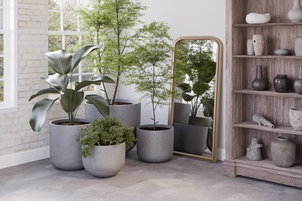 Flooring product rendering of stone-effect vinyl tiles in an entryway with concrete planters and a gold mirror
