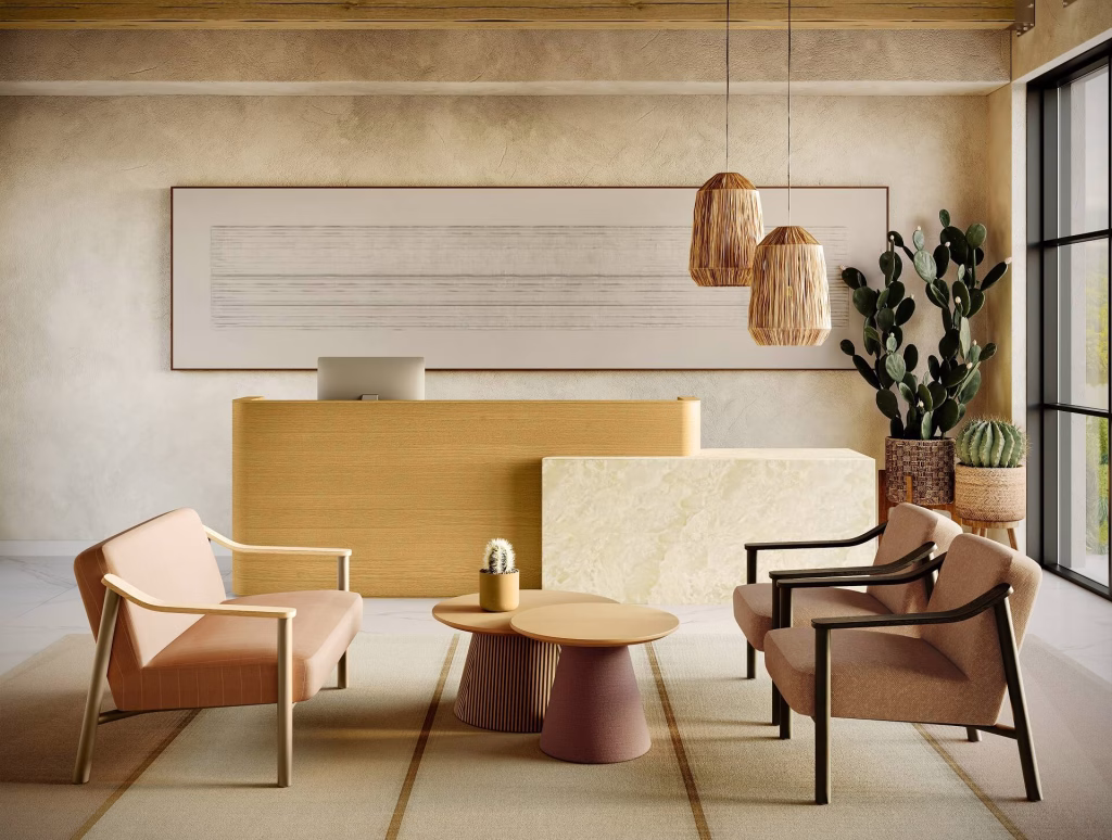 3D furniture visualization of a desert-toned reception area with blush and dusty rose lounge chairs, a fluted coffee table, and cactus decor